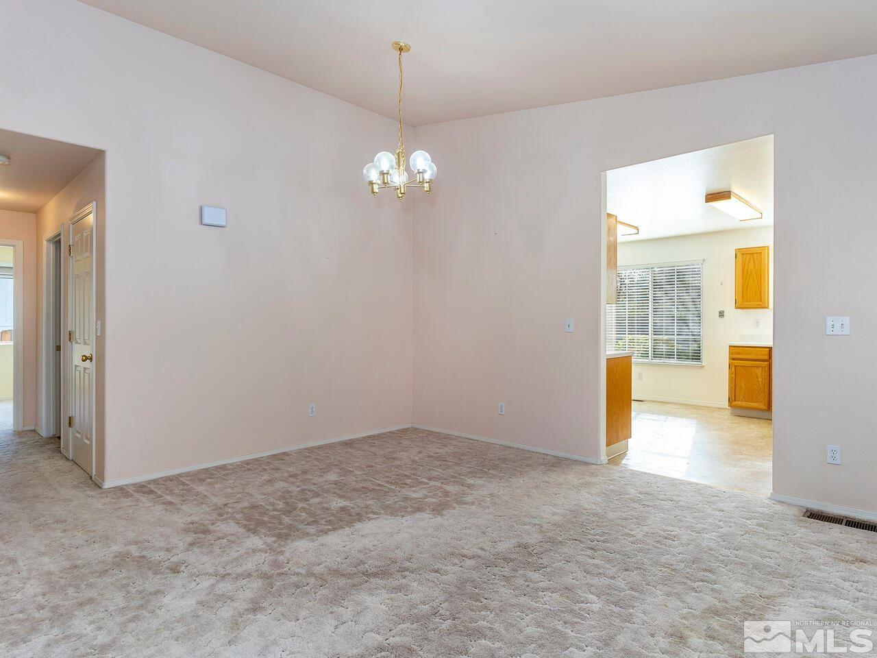 4765 Goodwin Road Sparks, NV 89436 - Photo 9 of 22 a view of an empty room with a window