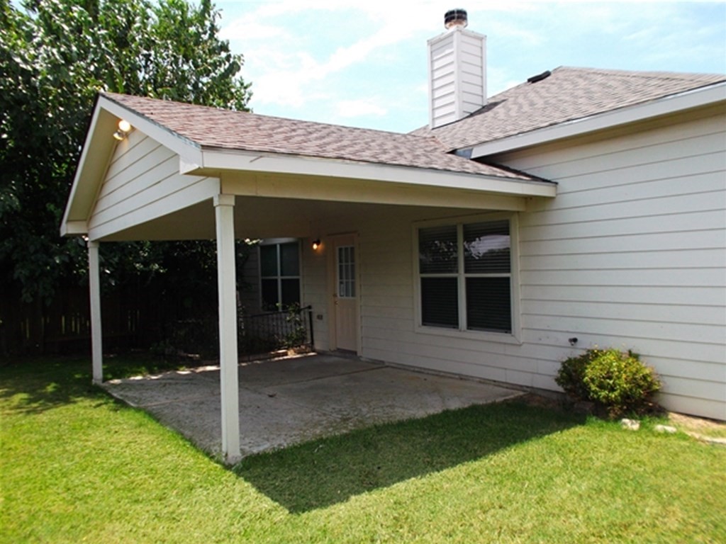 1835 Manor Drive Baytown, TX 77521 - Photo 16 of 16 a front view of a house with garden