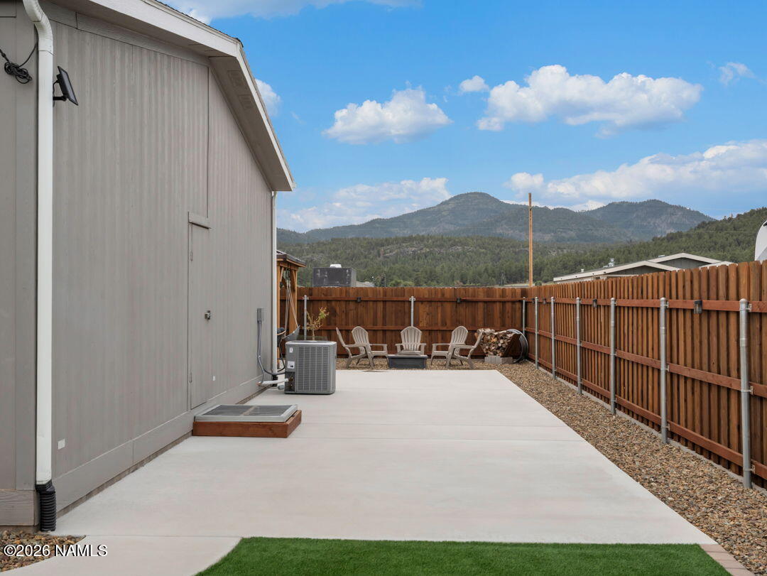 147 Pinecrest Trail Williams, AZ 86046 - Photo 34 of 39 a view of a terrace with couches and wooden fence