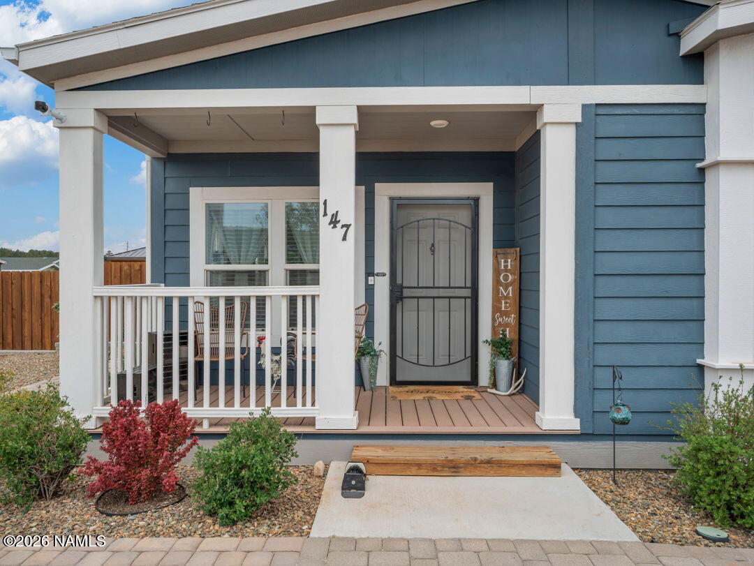 147 Pinecrest Trail Williams, AZ 86046 - Photo 5 of 39 a view of a house with a small yard and wooden floor and fence