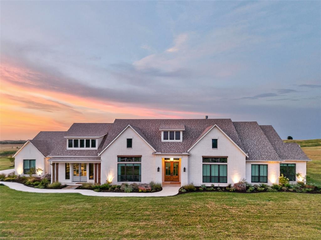10932 Gregory Road Sanger, TX 76266 - Photo 1 of 40 White brick exterior with a multi-gabled roof and dark-framed windows