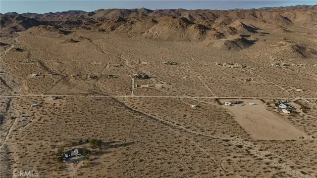 a view of an ocean beach and mountain