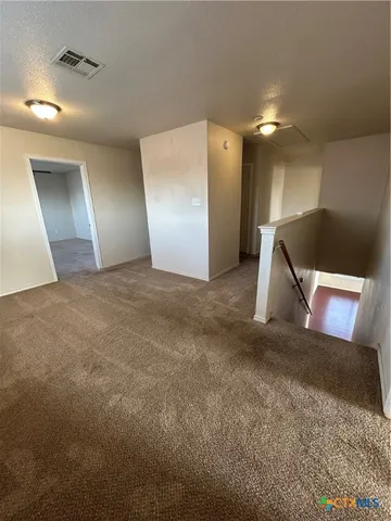 a view of a hallway with entryway