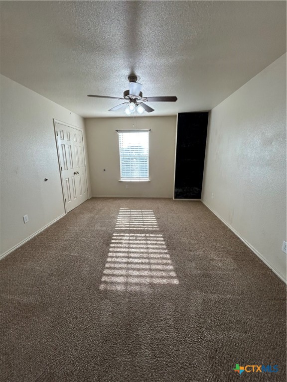 3043 Rain Dance Loop Harker Heights, TX 76548 - Photo 14 of 20 en empty room with windows and ceiling fan