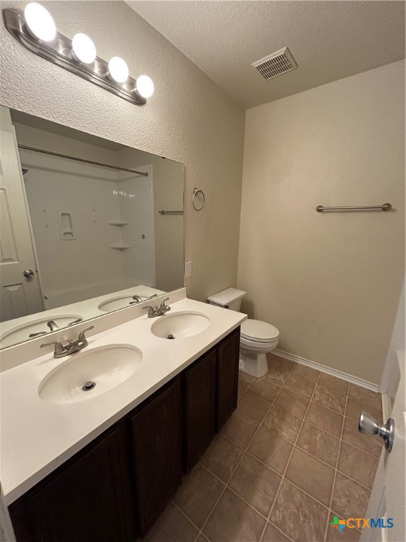 3043 Rain Dance Loop Harker Heights, TX 76548 - Photo 16 of 20 a bathroom with a sink and mirror with toilet