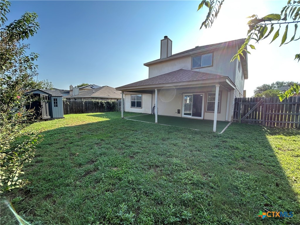 3043 Rain Dance Loop Harker Heights, TX 76548 - Photo 20 of 20 a view of a house with a swimming pool and a yard