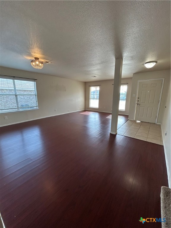 3043 Rain Dance Loop Harker Heights, TX 76548 - Photo 4 of 20 an empty room with wooden floor and windows