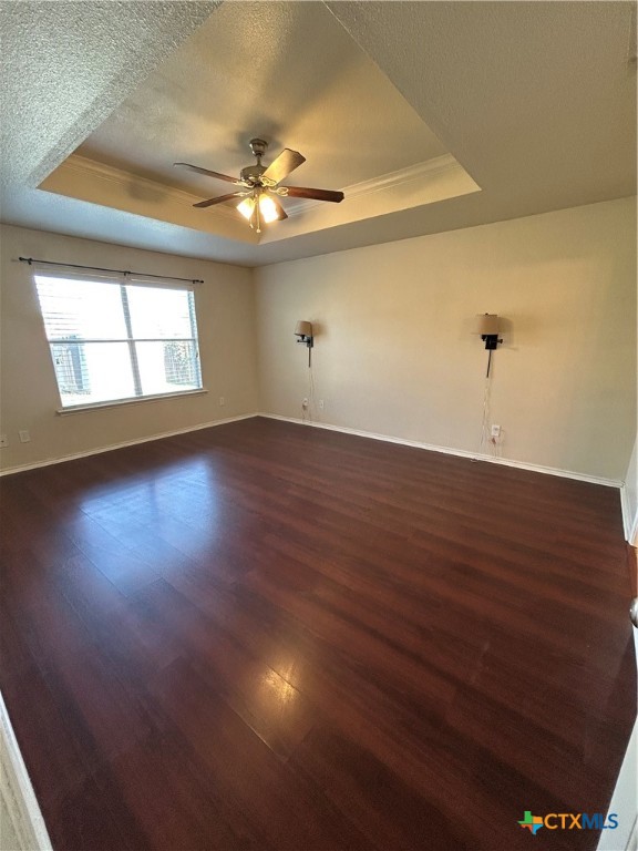 3043 Rain Dance Loop Harker Heights, TX 76548 - Photo 9 of 20 an empty room with wooden floor chandelier fan and windows