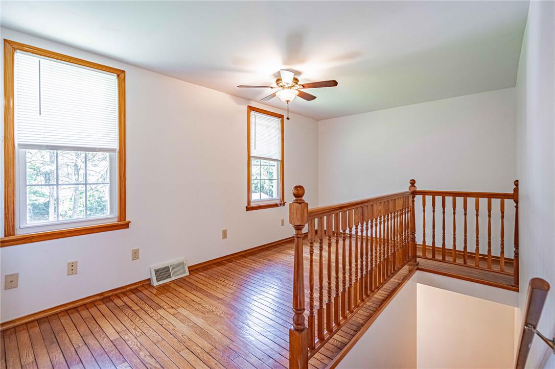 4165 East Texas Road Allentown, PA 18103 - Photo 38 of 56 Warm hardwood floors and abundant natural light define this inviting upper-level loft space.