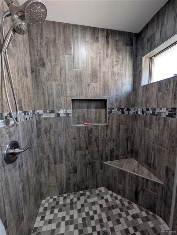 404 Jupiter Street Mission, TX 78572 - Photo 11 of 22 Bathroom featuring tiled walk-in shower.