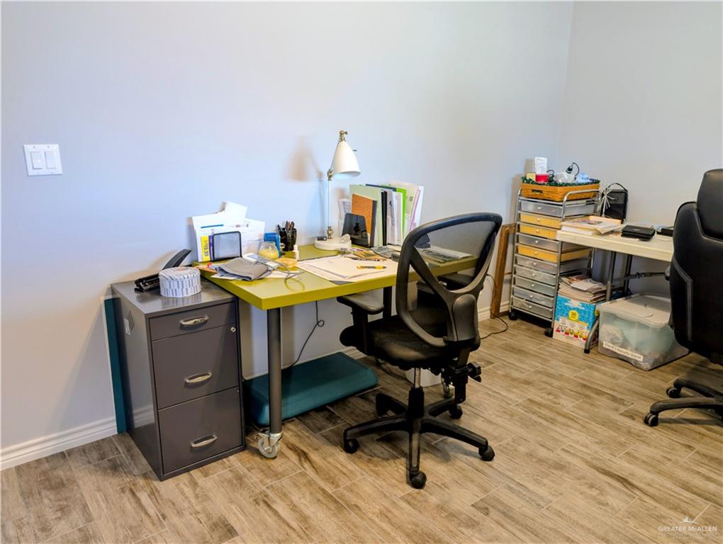 404 Jupiter Street Mission, TX 78572 - Photo 15 of 22 Office area with wood-style tile flooring.