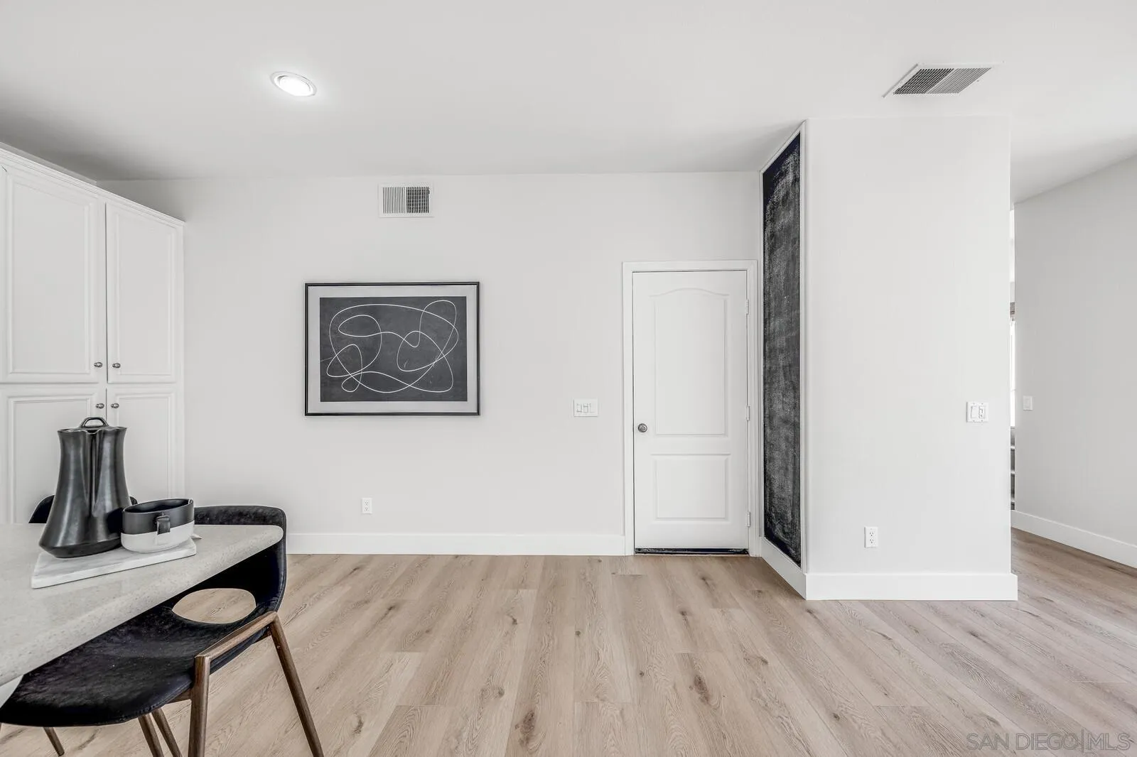 535 Anchorage Avenue Carlsbad, CA 92011 - Photo 14 of 36 a view of a workspace with furniture and wooden floor