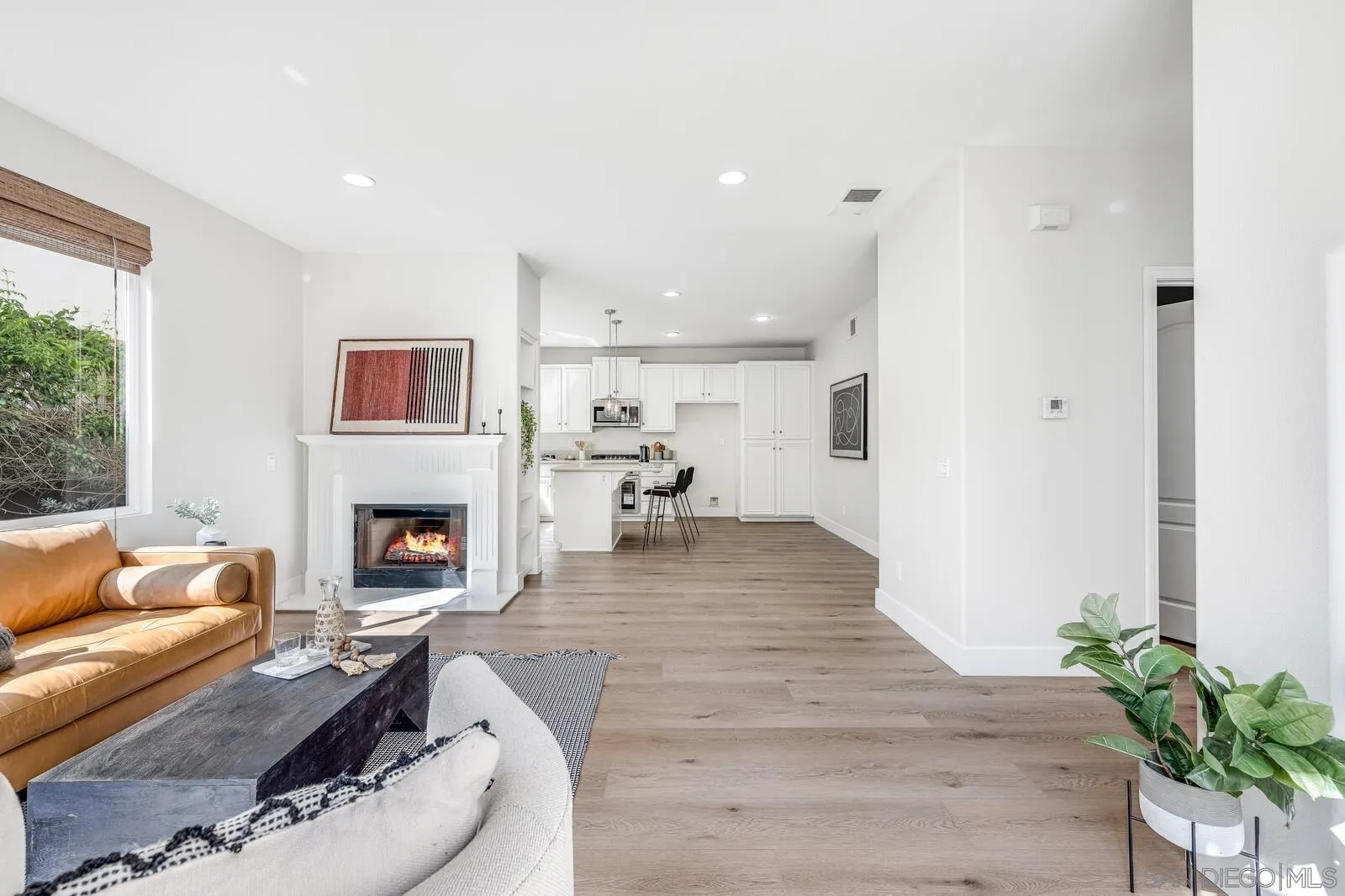 535 Anchorage Avenue Carlsbad, CA 92011 - Photo 15 of 36 a living room with furniture and a fireplace