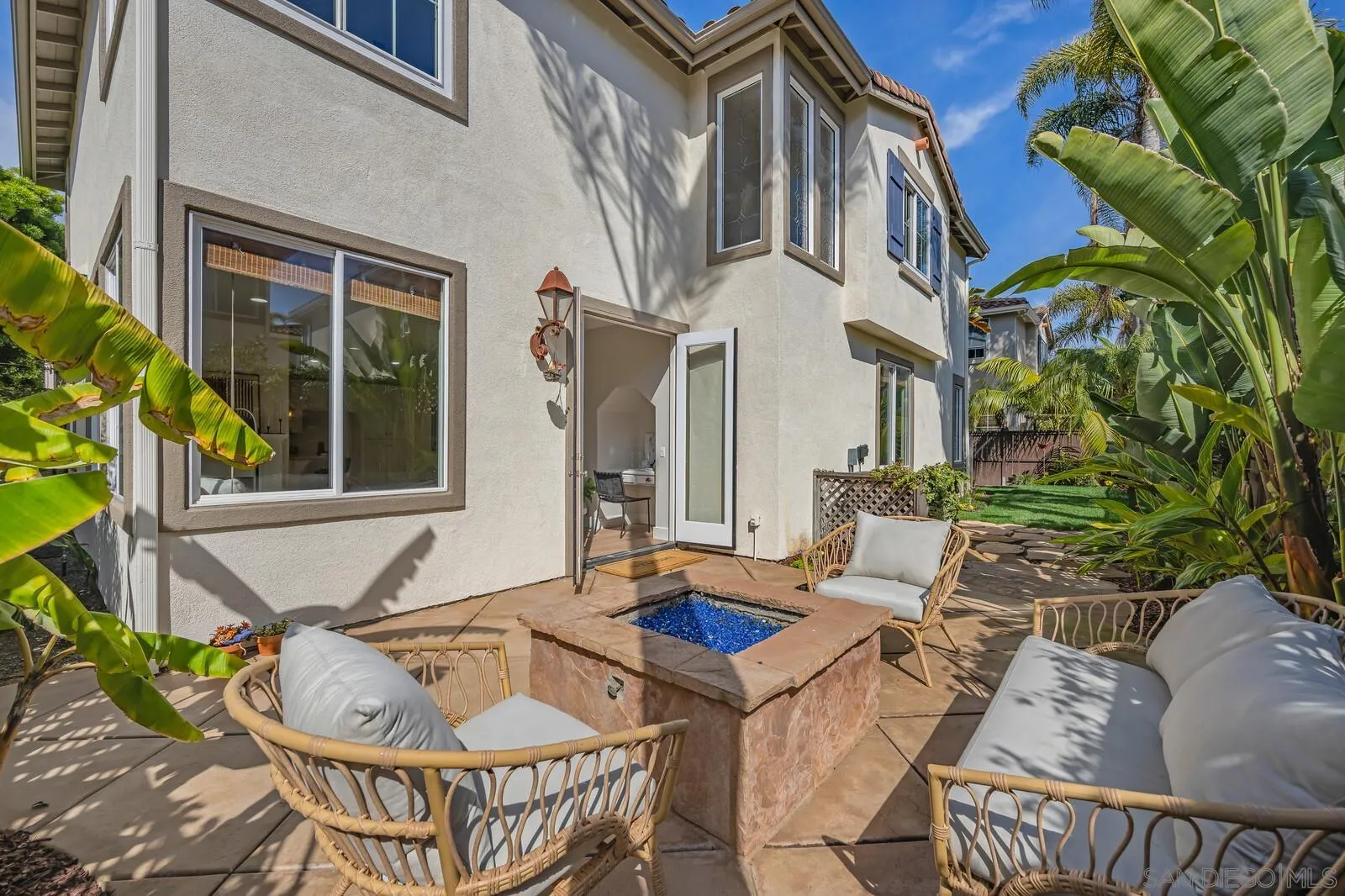 535 Anchorage Avenue Carlsbad, CA 92011 - Photo 18 of 36 a view of a patio with couches table and chairs and potted plants