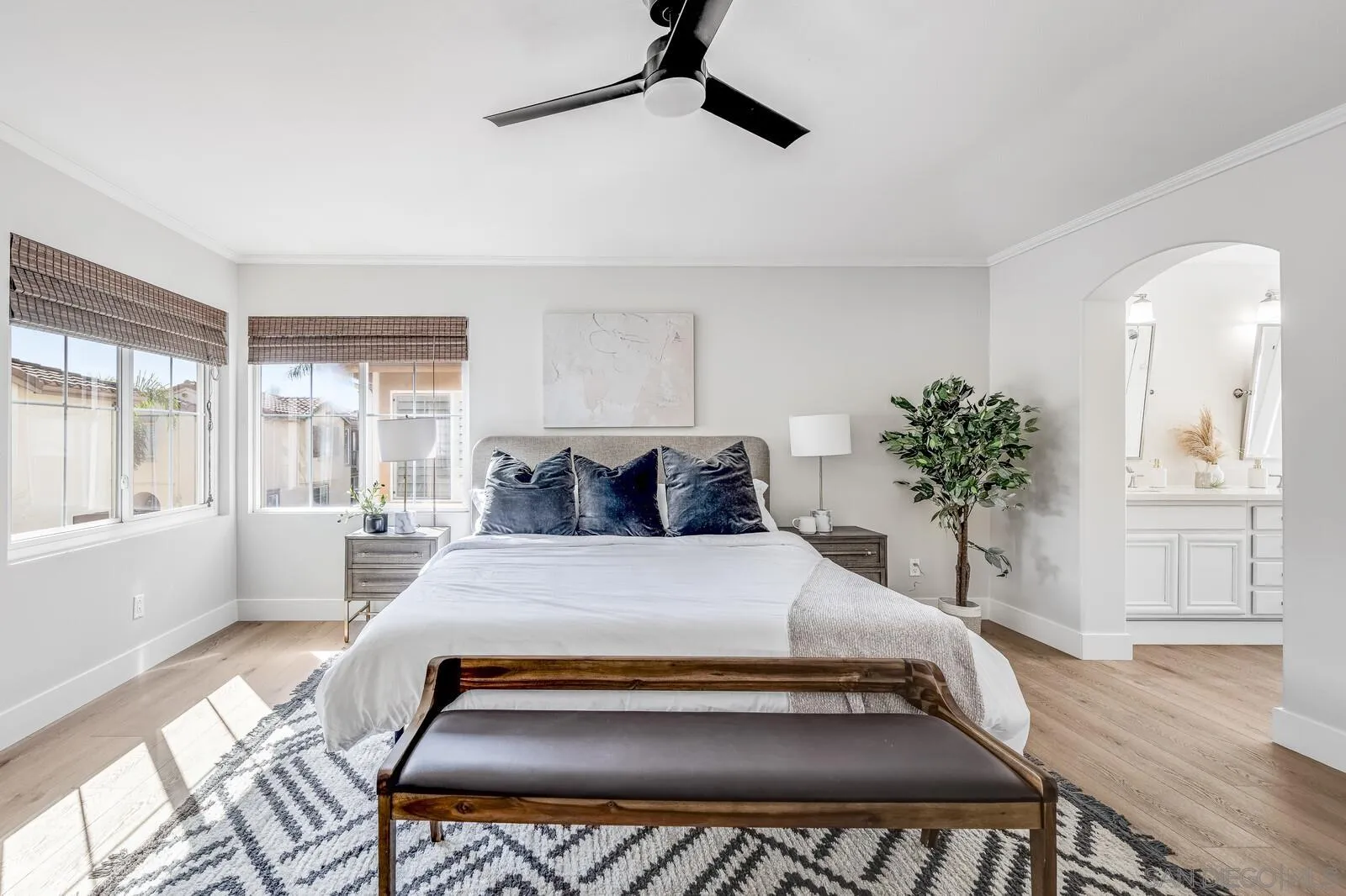 535 Anchorage Avenue Carlsbad, CA 92011 - Photo 23 of 36 a bedroom with a large bed and a potted plant