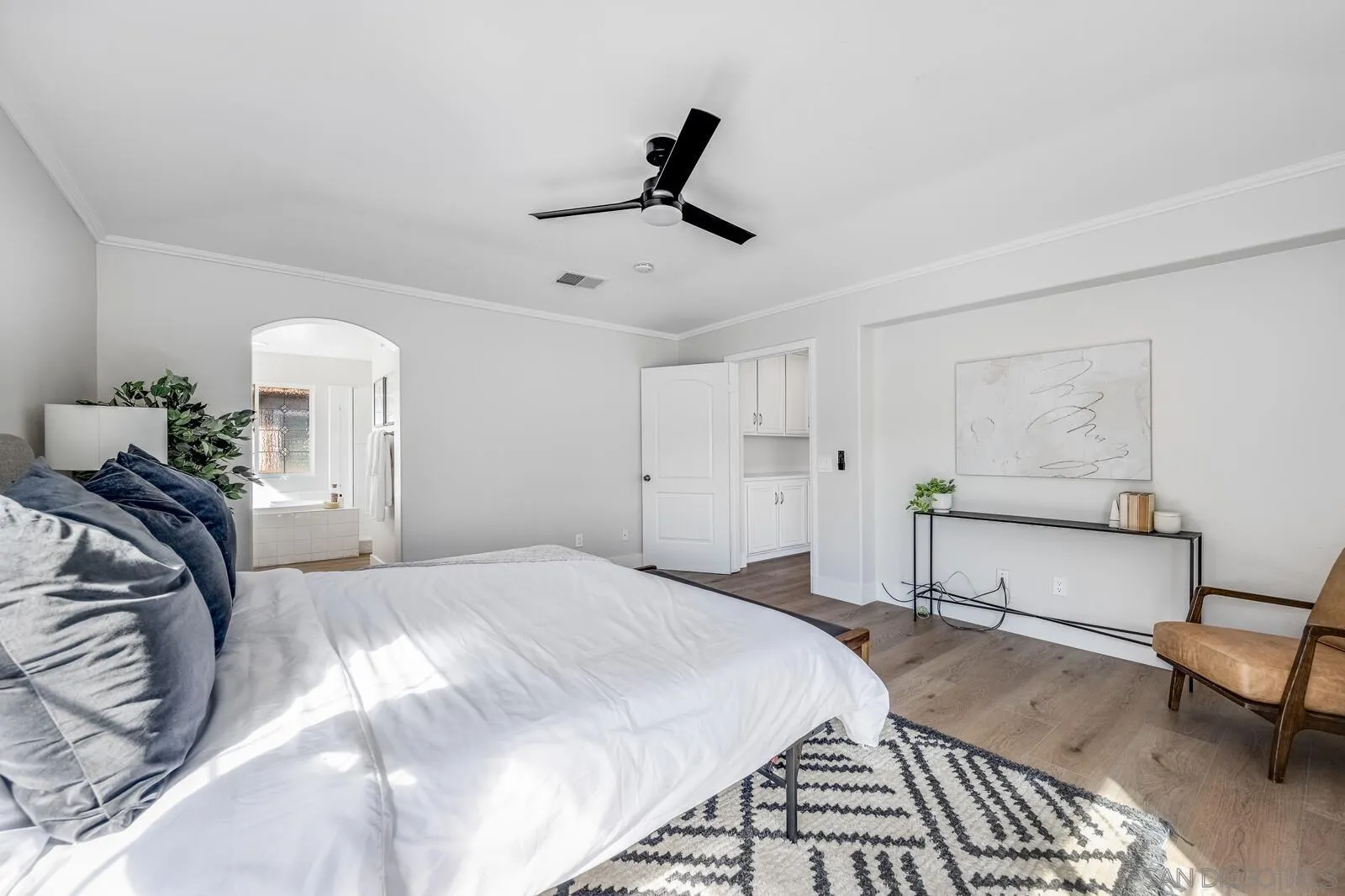 535 Anchorage Avenue Carlsbad, CA 92011 - Photo 24 of 36 a bedroom with a bed and a chandelier