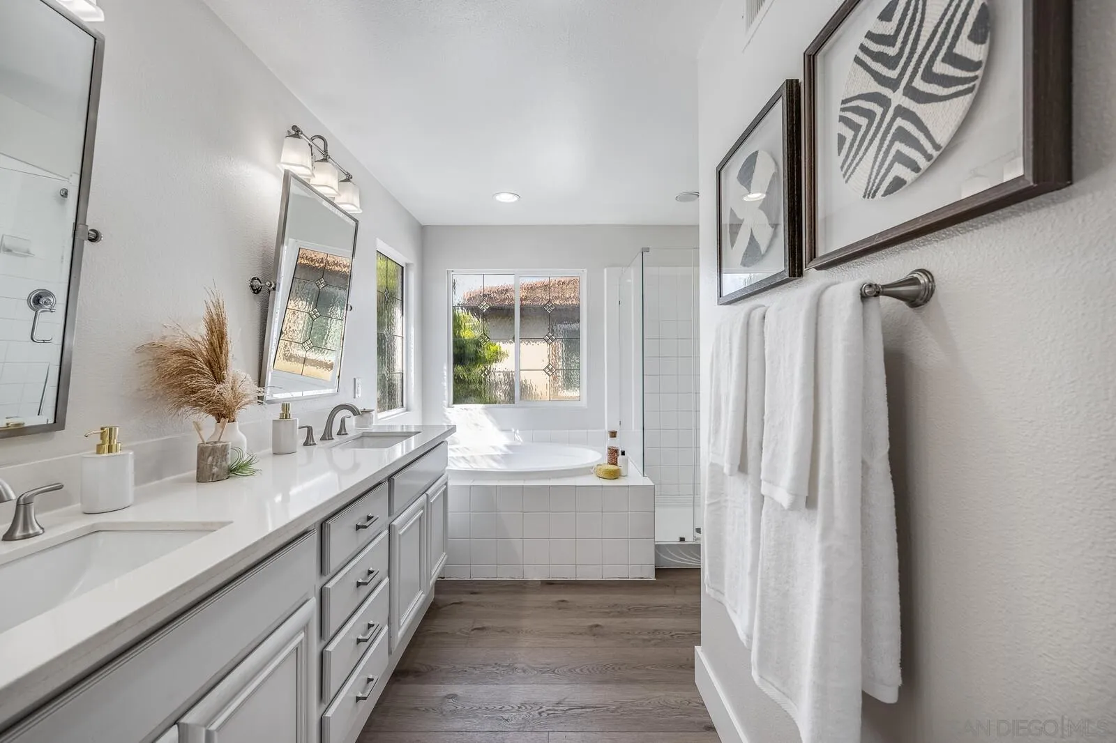535 Anchorage Avenue Carlsbad, CA 92011 - Photo 25 of 36 a spacious bathroom with a double vanity sink and a mirror