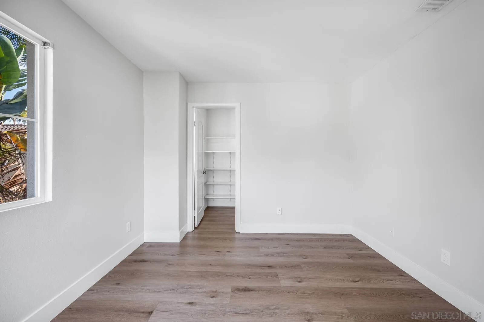 535 Anchorage Avenue Carlsbad, CA 92011 - Photo 33 of 36 a view of a room with wooden floor and brick walls