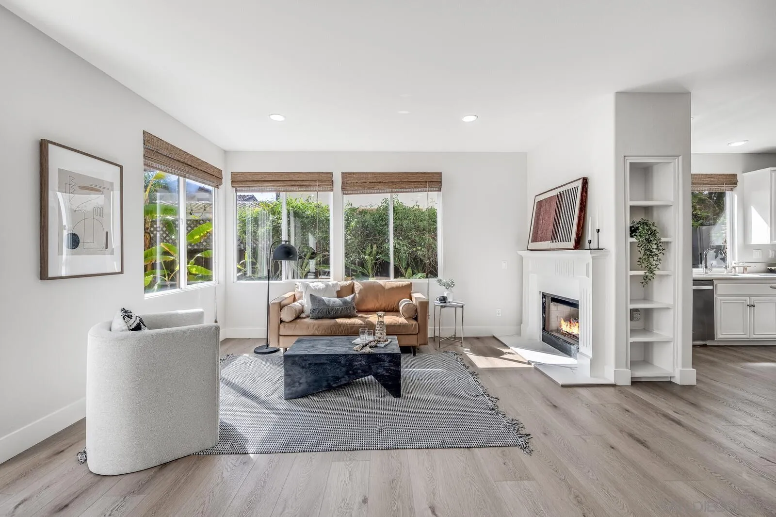 535 Anchorage Avenue Carlsbad, CA 92011 - Photo 10 of 36 a living room with fireplace furniture and a large window