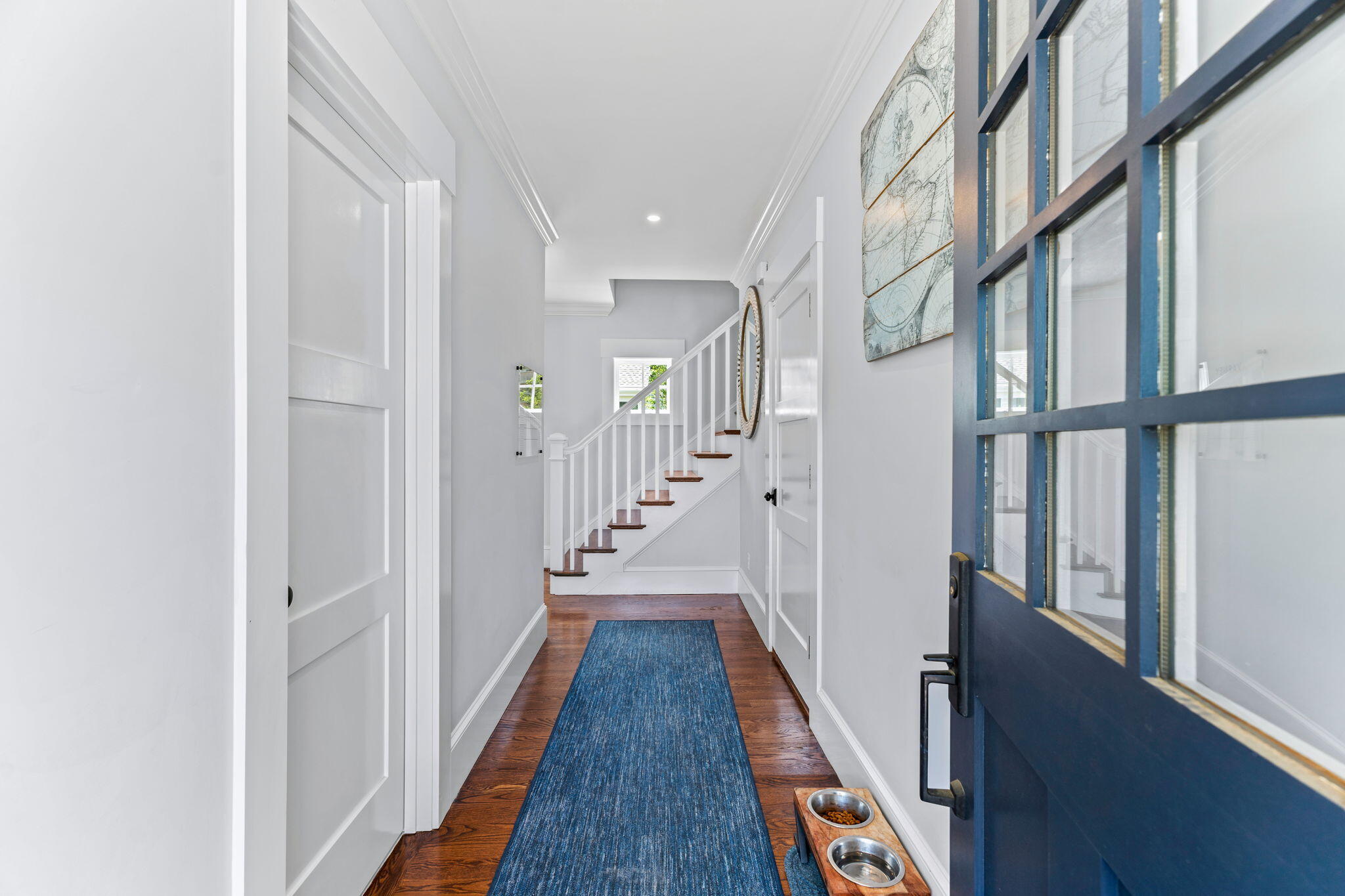 101 Warren Street Osterville, MA 02655 - Photo 15 of 39 a view of a hallway with wooden floor and staircase
