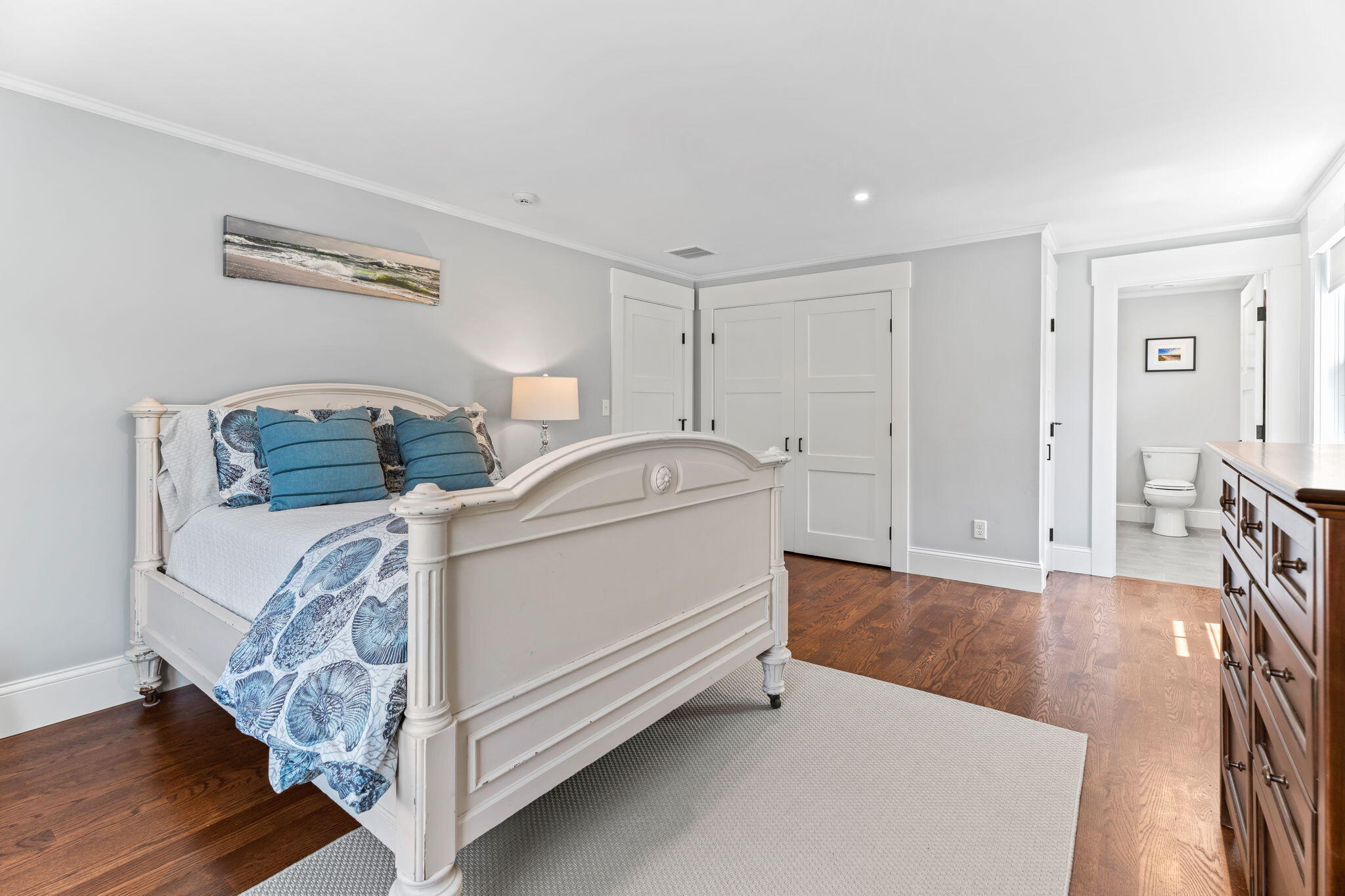 101 Warren Street Osterville, MA 02655 - Photo 20 of 39 a bedroom with a bed and wooden floor
