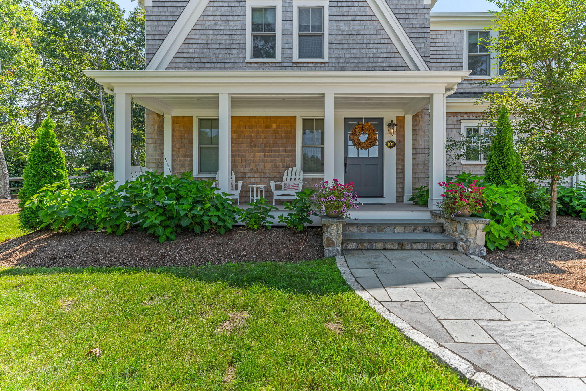 101 Warren Street Osterville, MA 02655 - Photo 2 of 39 a front view of a house with garden