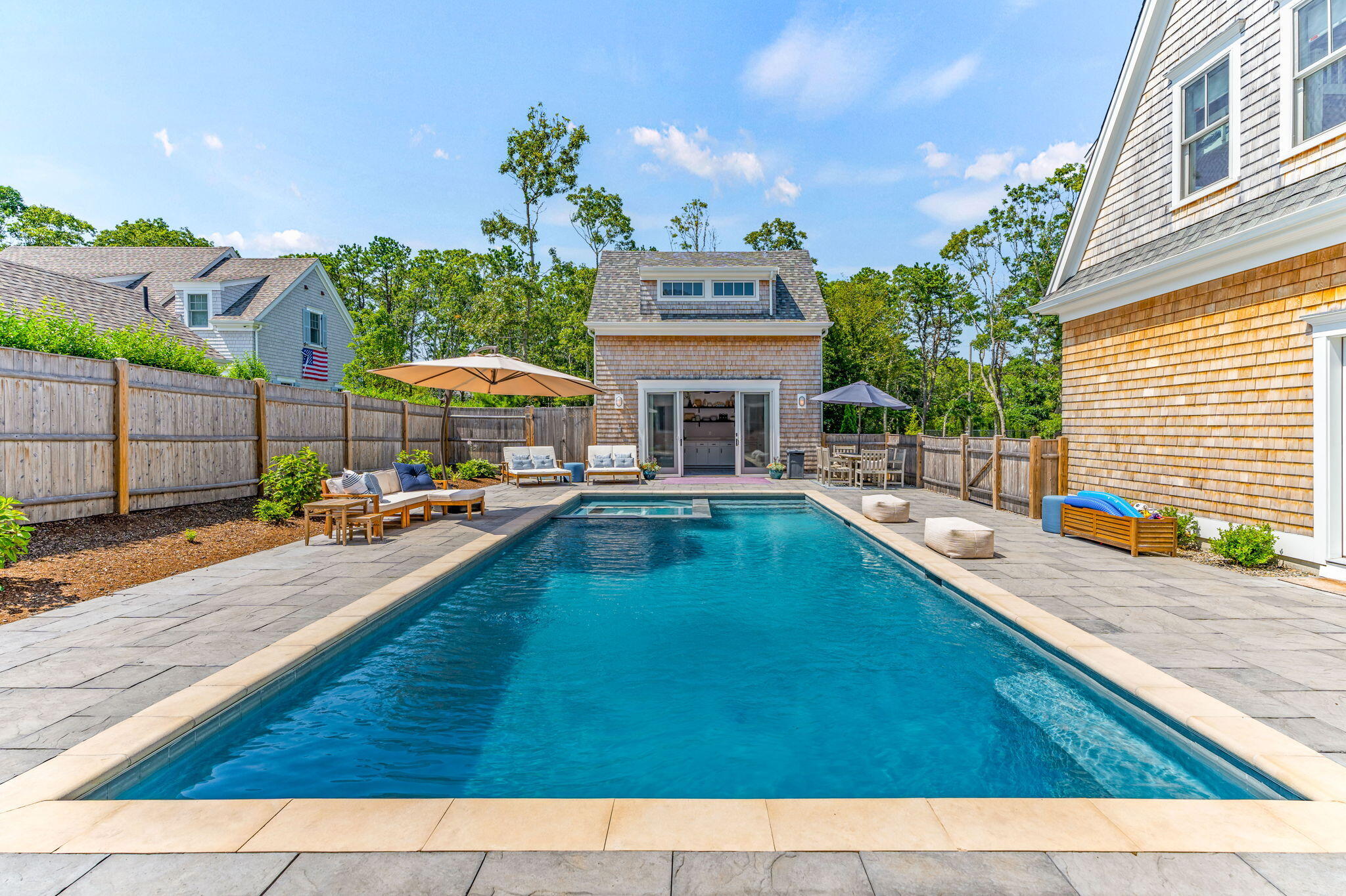 101 Warren Street Osterville, MA 02655 - Photo 24 of 39 a swimming pool with outdoor seating and yard