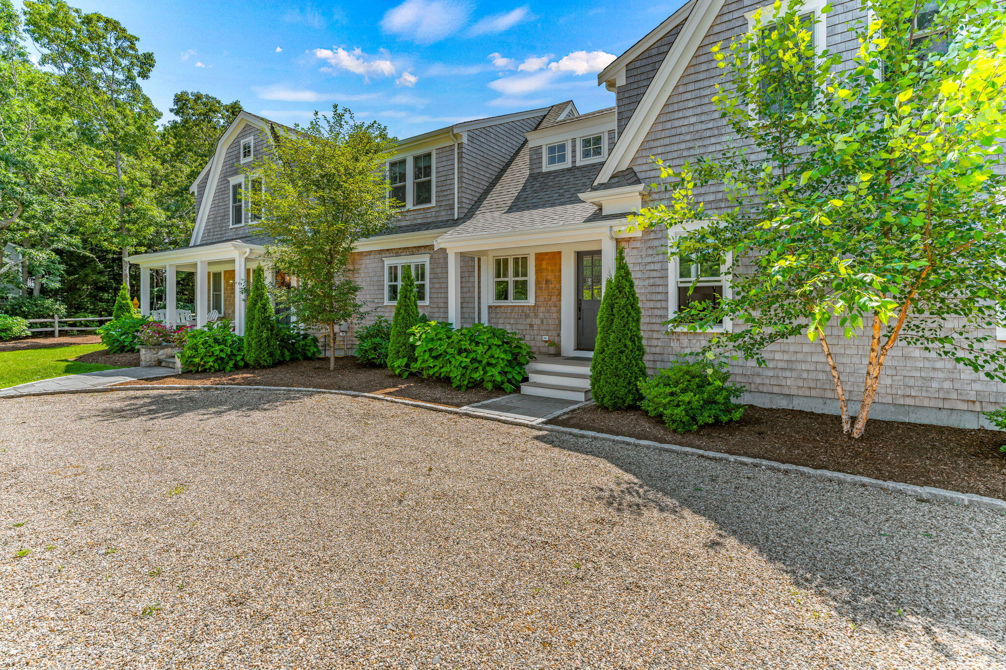 101 Warren Street Osterville, MA 02655 - Photo 37 of 39 a front view of a house with a yard and a garage