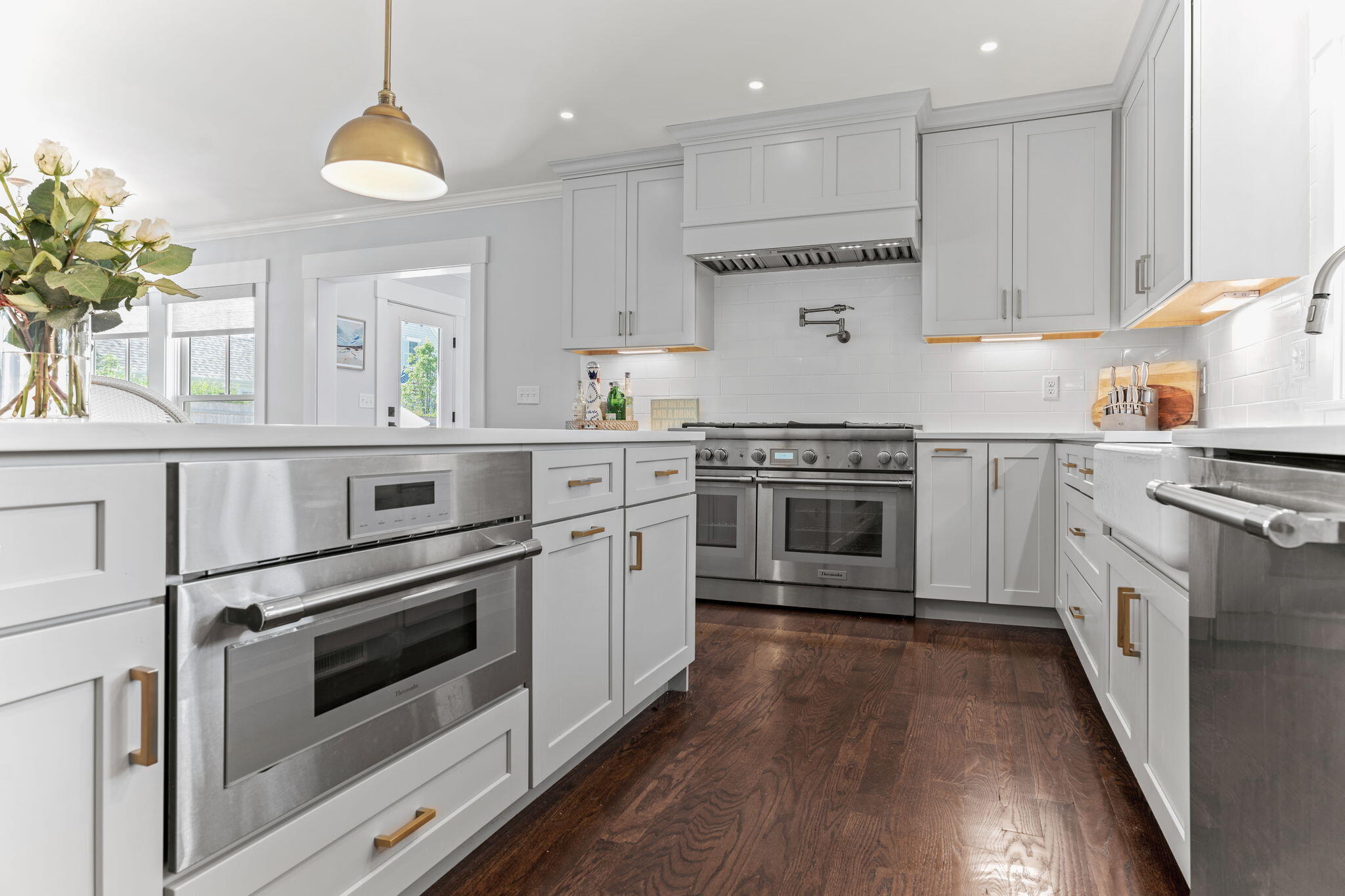 101 Warren Street Osterville, MA 02655 - Photo 4 of 39 a kitchen with granite countertop stainless steel appliances and wooden cabinets
