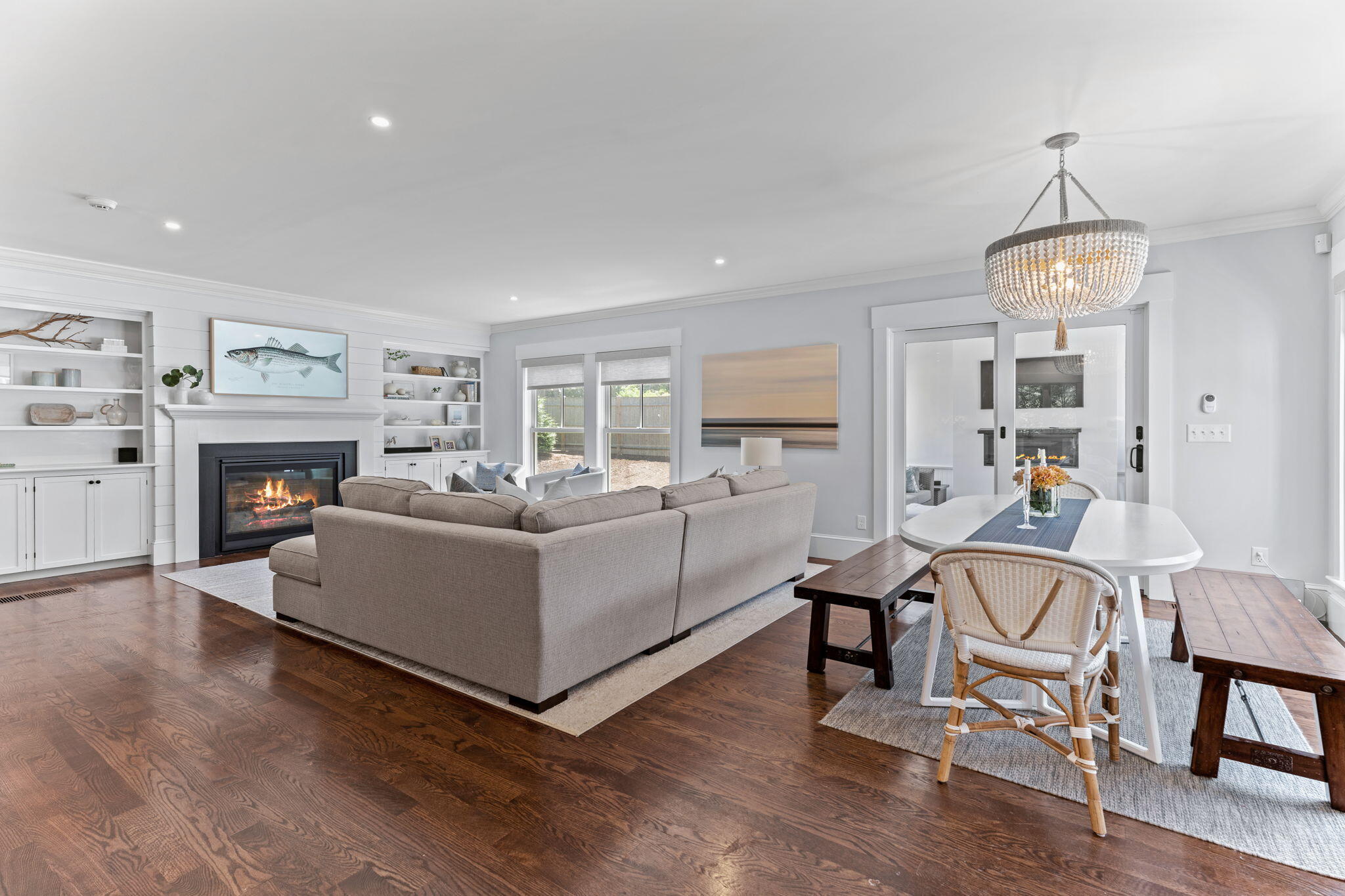 101 Warren Street Osterville, MA 02655 - Photo 7 of 39 a living room with furniture a fireplace and kitchen view