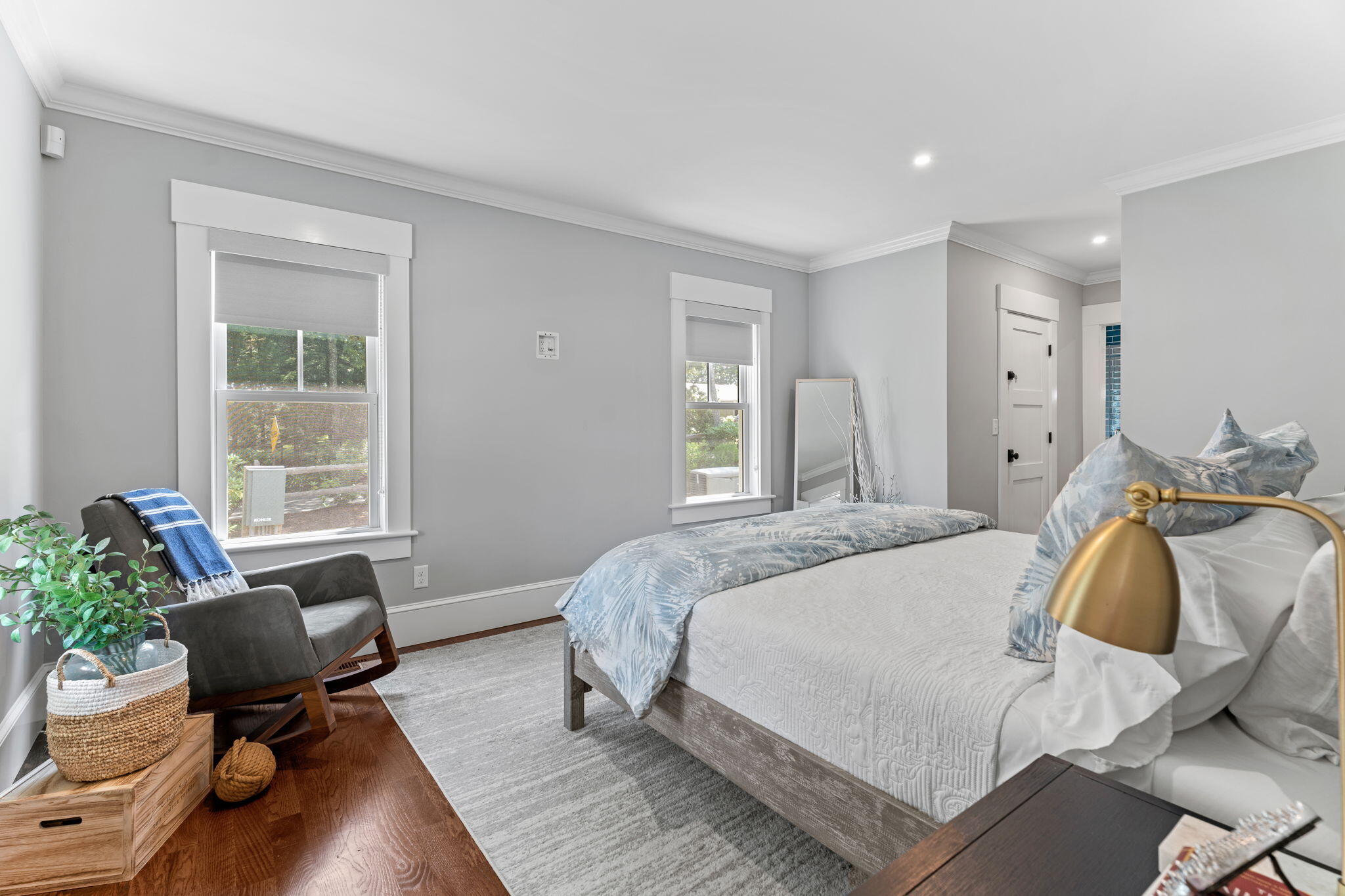 101 Warren Street Osterville, MA 02655 - Photo 10 of 39 a spacious bedroom with a bed and chair