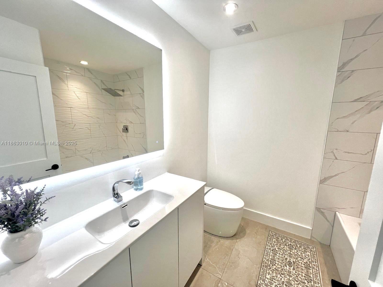 1590 Southwest 139th Avenue Davie, FL 33325 - Photo 14 of 20 a bathroom with a sink and a mirror