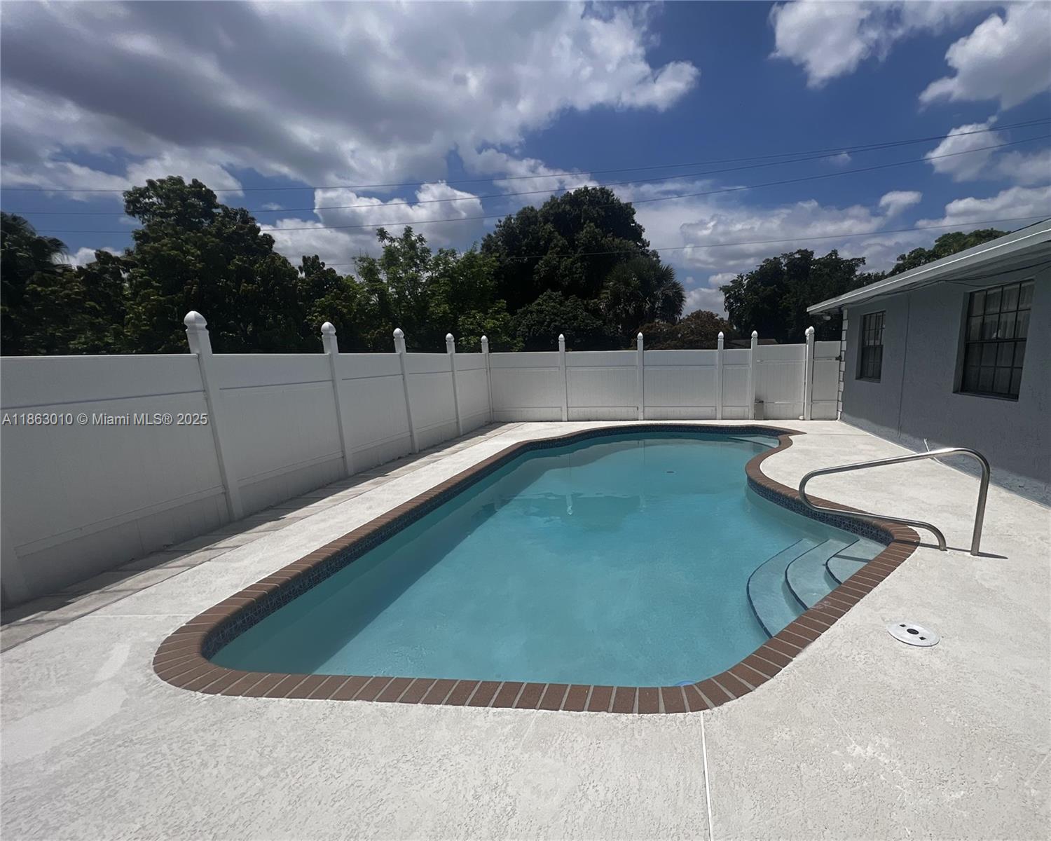 1590 Southwest 139th Avenue Davie, FL 33325 - Photo 17 of 20 a view of a swimming pool with a yard