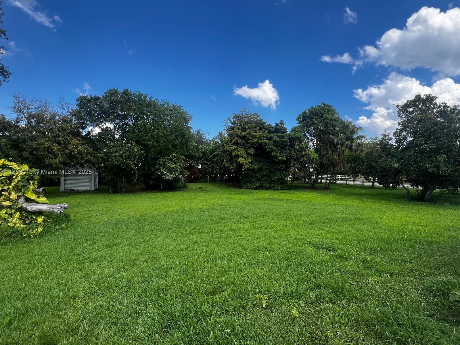 1590 Southwest 139th Avenue Davie, FL 33325 - Photo 18 of 20 a view of a golf course with a table and chairs