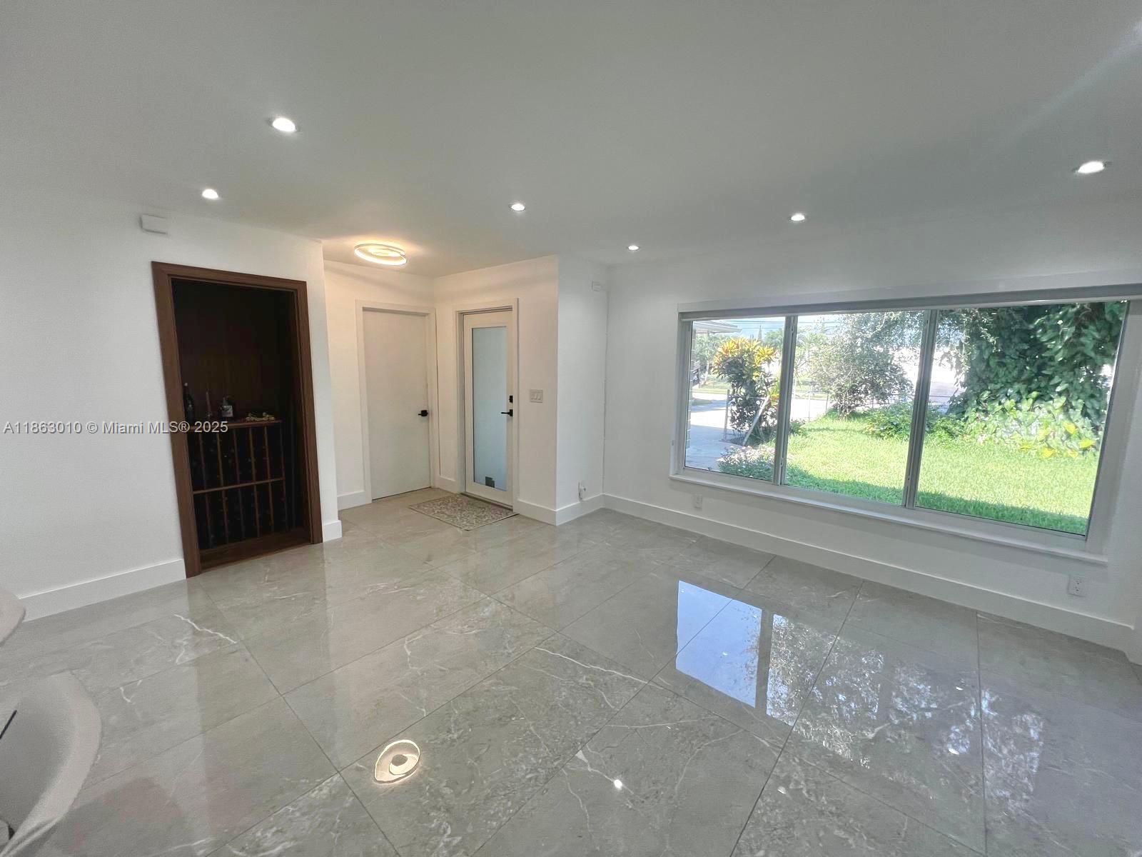 1590 Southwest 139th Avenue Davie, FL 33325 - Photo 4 of 20 a view of an empty room with a window