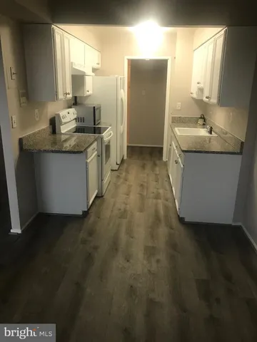 a bathroom with a sink a mirror and a bathtub