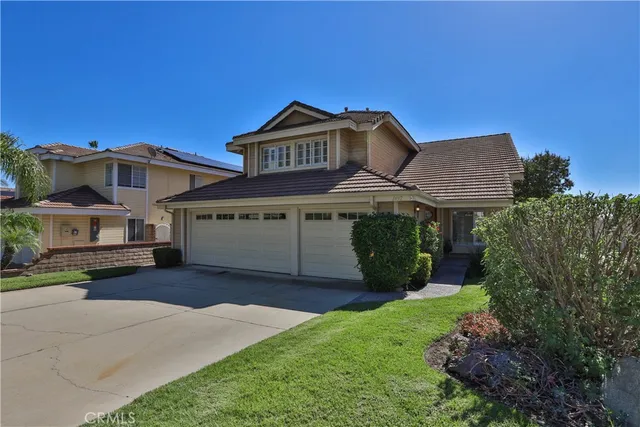a view of a house with a garden and deck