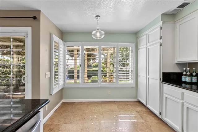 a kitchen that has a lot of cabinets in it