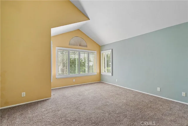 a view of a room with large windows