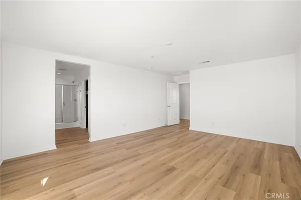 a bathroom with a double vanity sink mirror and shower