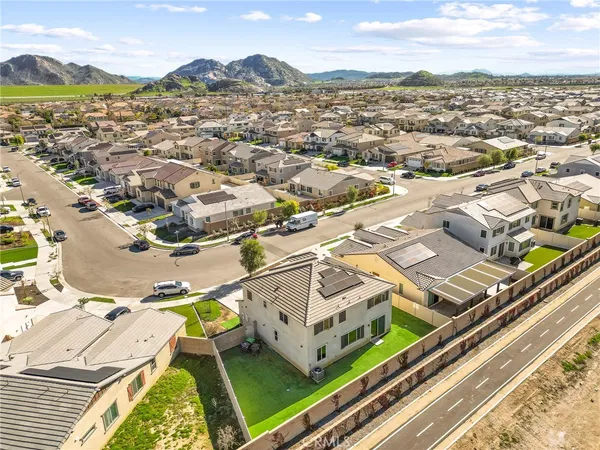 an aerial view of residential houses with outdoor space