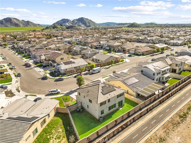 an aerial view of residential houses with outdoor space