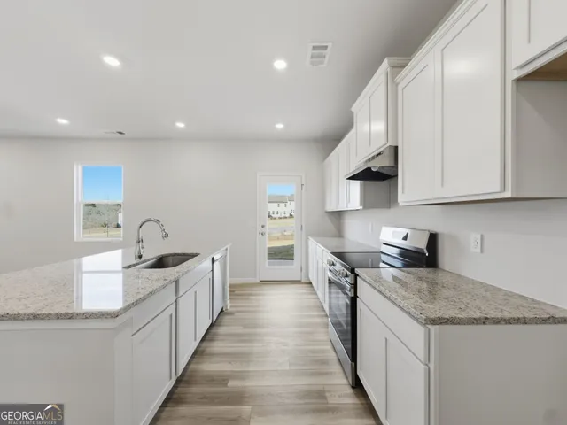 a bathroom view of a toilet and a sink