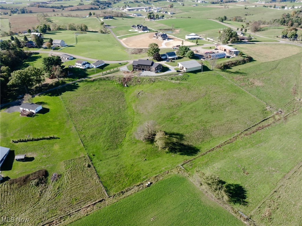 Birds eye view of property with a rural view