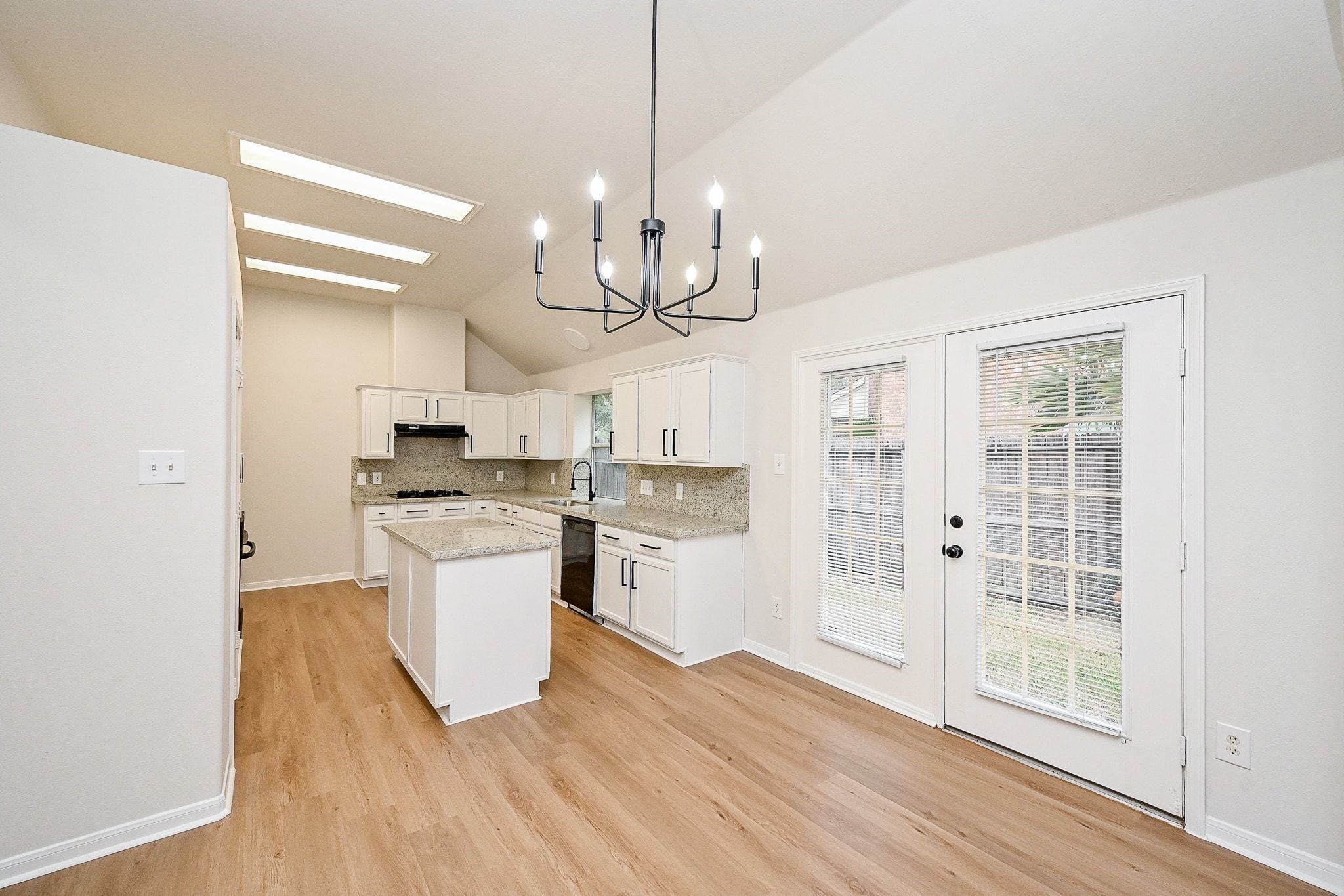 13007 Turnbridge Trail Houston, TX 77065 - Photo 15 of 20 a kitchen with a refrigerator a sink and cabinets