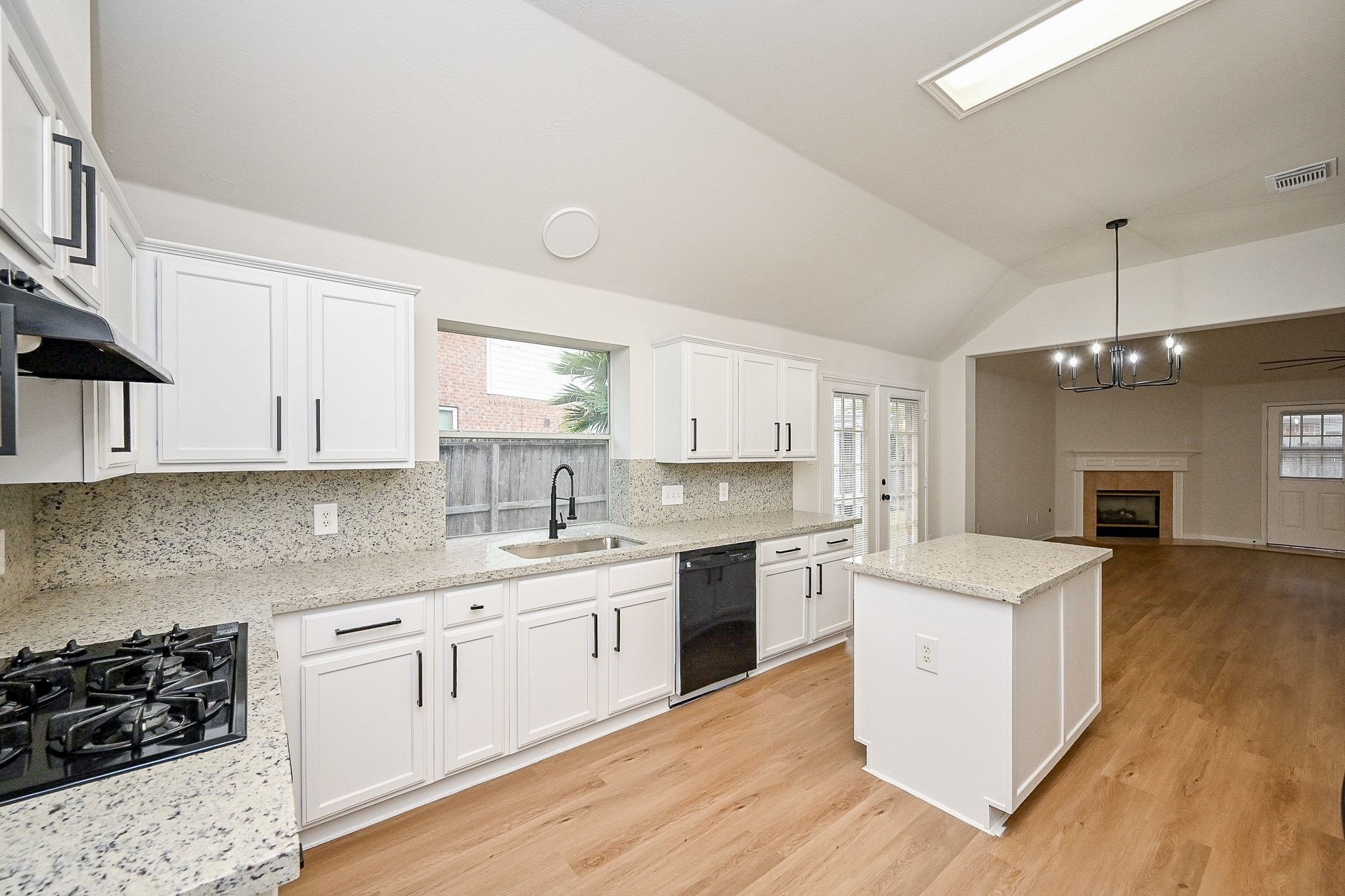 13007 Turnbridge Trail Houston, TX 77065 - Photo 17 of 20 a kitchen with a sink stove a refrigerator and white cabinets