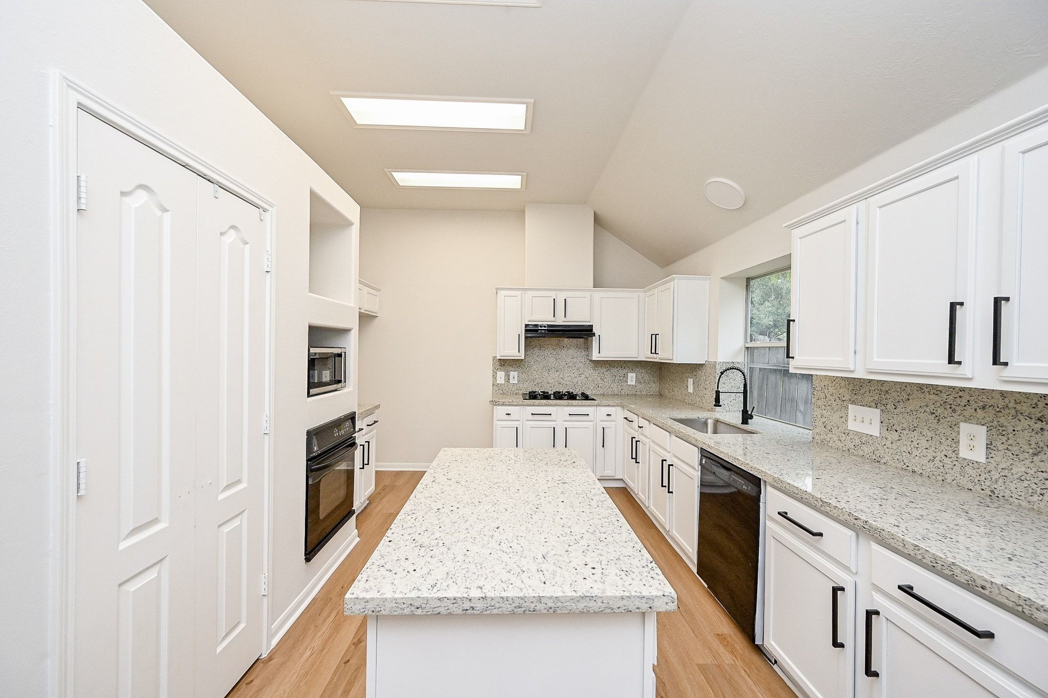 13007 Turnbridge Trail Houston, TX 77065 - Photo 18 of 20 a kitchen with granite countertop a sink stove and refrigerator