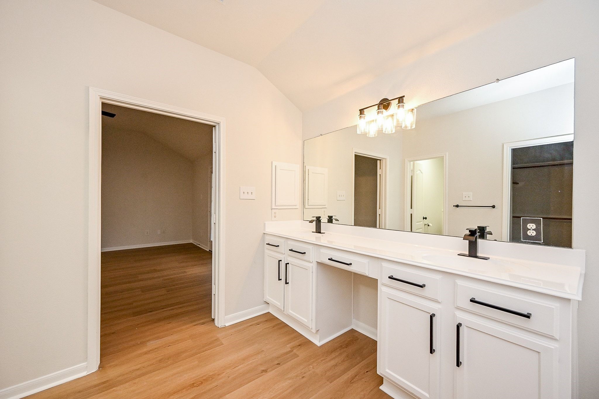 13007 Turnbridge Trail Houston, TX 77065 - Photo 6 of 20 a kitchen with a sink cabinets and wooden floor