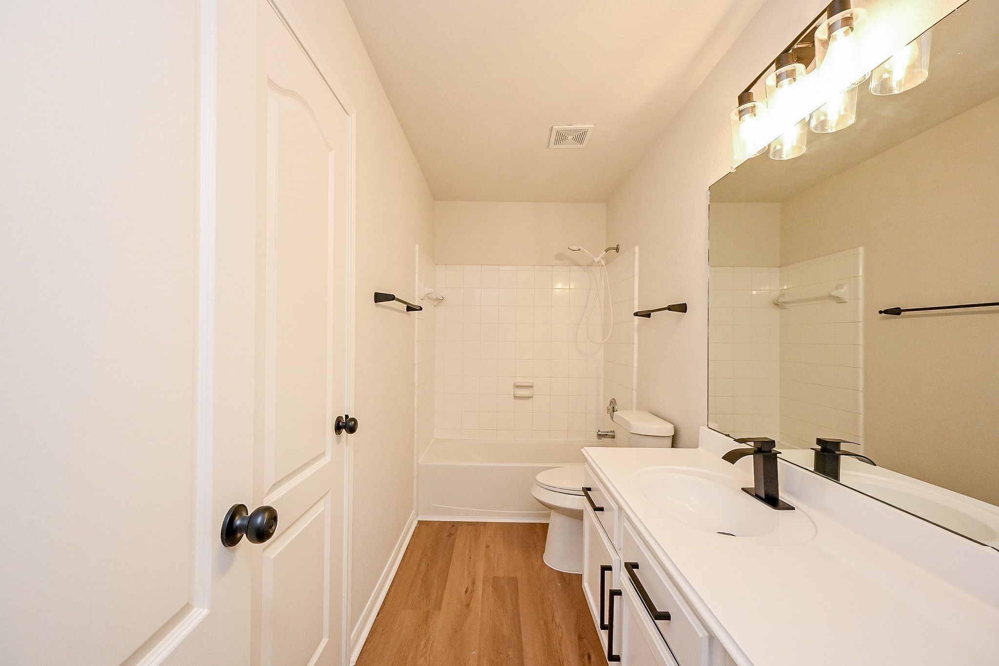13007 Turnbridge Trail Houston, TX 77065 - Photo 8 of 20 a bathroom with a sink a toilet a mirror and shower