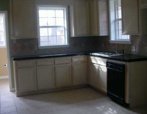 449 Southern Street Corpus Christi, TX 78404 - Photo 4 of 10 a kitchen with a sink cabinets and window